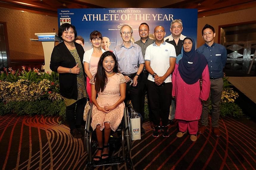 Yip and fellow nominee Khairul Anwar (third from right) with some of the 20 ST readers invited to the event. The ST Athlete of the Year accolade was launched in 2008 and is backed by F&N's 100Plus.