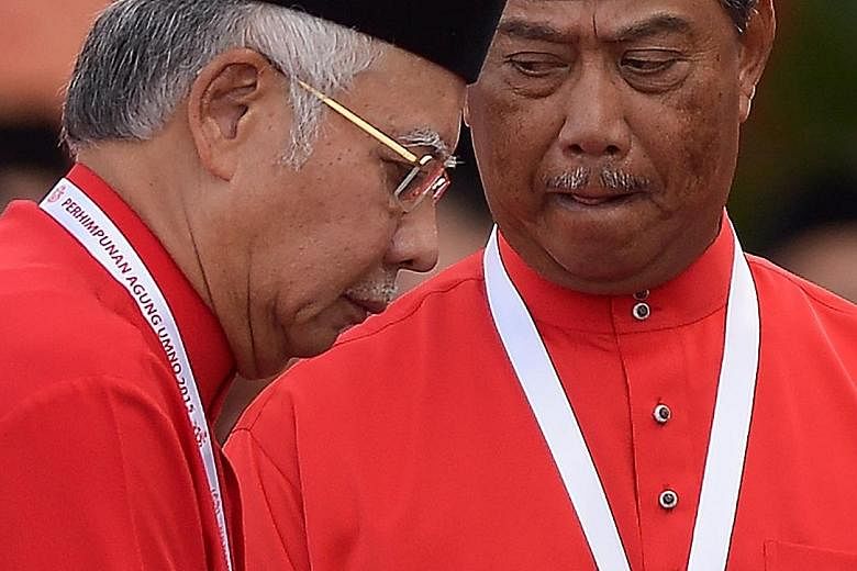 Malaysian Prime Minister Najib Razak (left), who is Umno president, and former deputy prime minister Muhyiddin Yassin at the party's annual congress last December. The suspension of Tan Sri Muhyiddin as Umno deputy president means that he can no long