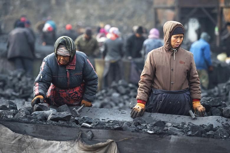 Coal workers in Datong, Shanxi province. Such workers are at risk of losing their jobs if capacity is cut in the next few years.