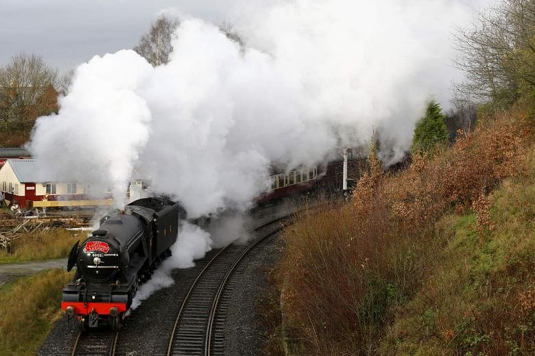 The Flying Scotsman steam engine leaving East Lancashire Railway in Bury, Britain, last month. One of the world's most famous steam engines, it is set to return after a decade of restoration and more than 80 years since it became the first locomotive to r