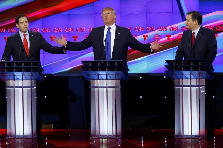 Mr Trump is flanked by Mr Rubio (far left) and Mr Cruz in Thursday's debate in Houston.The debate is the Republicans' most explosive one to date. 