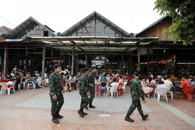 Thai soldiers patrolling a pier at Chao Phraya River in Bangkok on Feb 16. The Erawan Shrine attackers had planted a bomb at the Chao Phraya Princess Pier, where hundreds of Chinese tourists gather each day to board dinner cruises, but it failed to detona