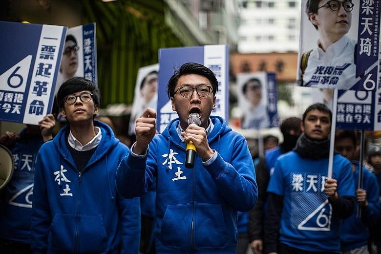 Mr Edward Leung (centre), a leader of the Hong Kong Indigenous activist group, speaking as he attends a pre-election campaign in Hong Kong yesterday. Hong Kongers head to the polls today to vote in a legislative by-election for a seat vacated by a pr