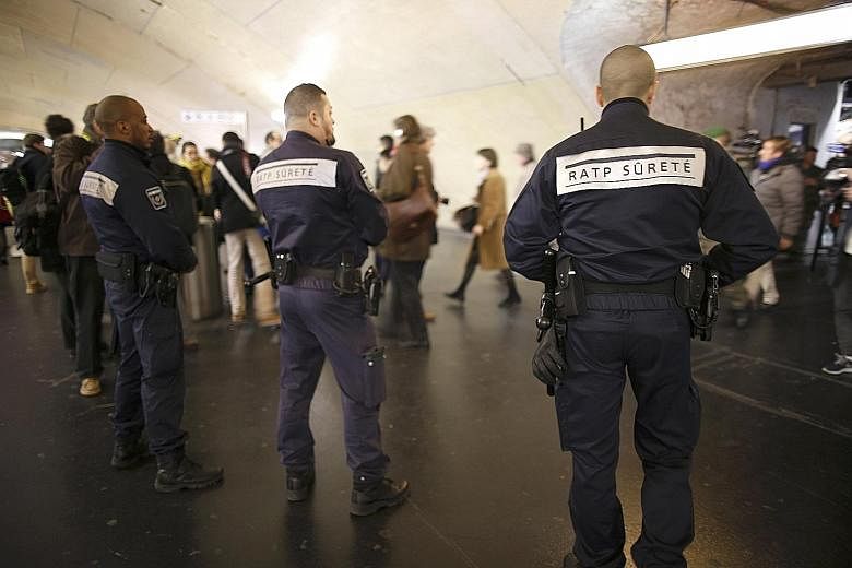 Security guards from the RATP patrolling inside the suburban rapid transit and metro station of Auber in Paris, France, last December amid a security alert during the Christmas and New Year holiday season, following the November shooting attacks in t