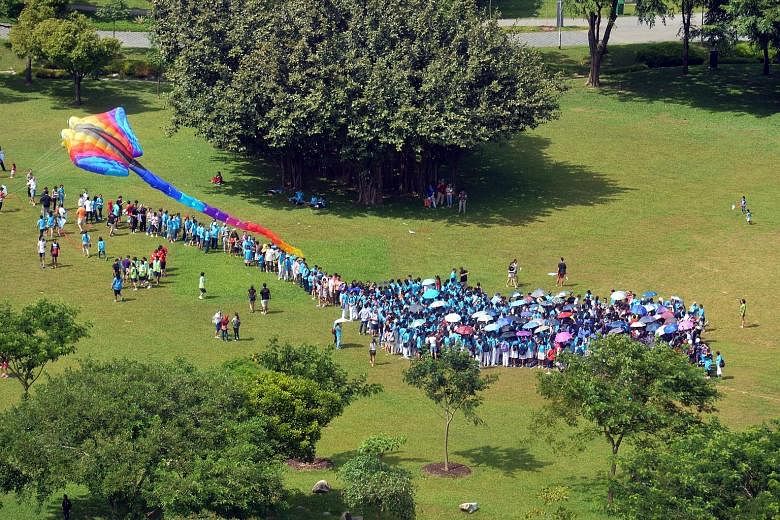 More than 660 people gathered at Bishan-Ang Mo Kio Park yesterday to mark the launch of the 20th-anniversary celebrations for the Down Syndrome Association (Singapore). The group earned a spot in the Singapore Book of Records for the most people asse
