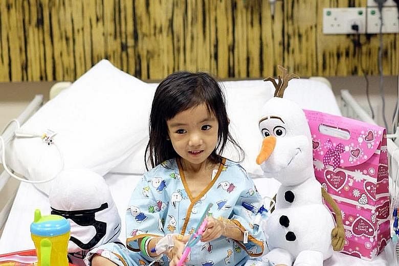 Three-year-old Caitlin in NUH among gifts from well-wishers. Doctors have been trying to find out how insect bites found on her ankle have gone on to cause life-threatening symptoms.