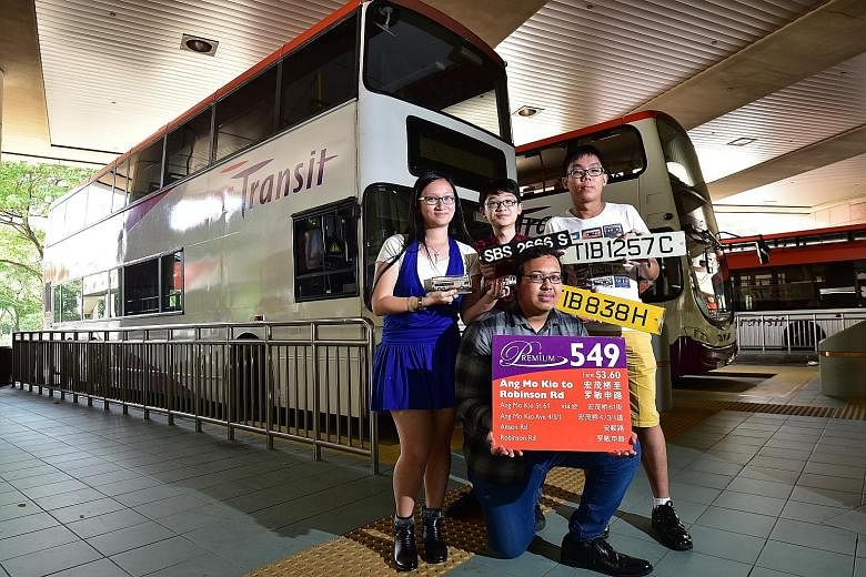 Members of the Singapore Bus Spotters Association include (from left) university undergraduate Liu Ying Jun, 24; secondary school student Matthew Tay, 16; full-time national serviceman Teo Boon Kiat, 22; and (kneeling) Institute of Technical Educatio