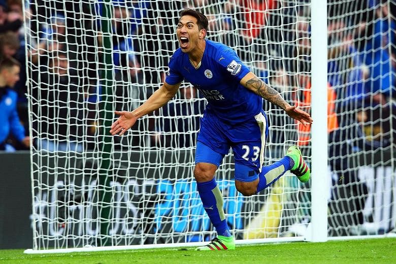 Leicester City's Leonard Ulloa roars in joy after netting their late winner against Norwich City on Saturday. The victory ensured that the Foxes remained top of the English Premier League regardless of the results of their nearest challengers Tottenh