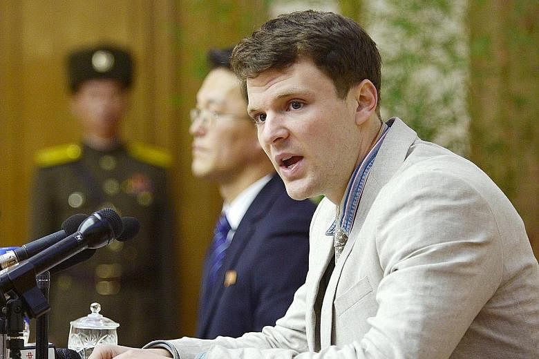 Mr Warmbier attending a news conference in Pyongyang yesterday. He has been detained in North Korea since early January for allegedly trying to steal a propaganda slogan from his Pyongyang hotel.