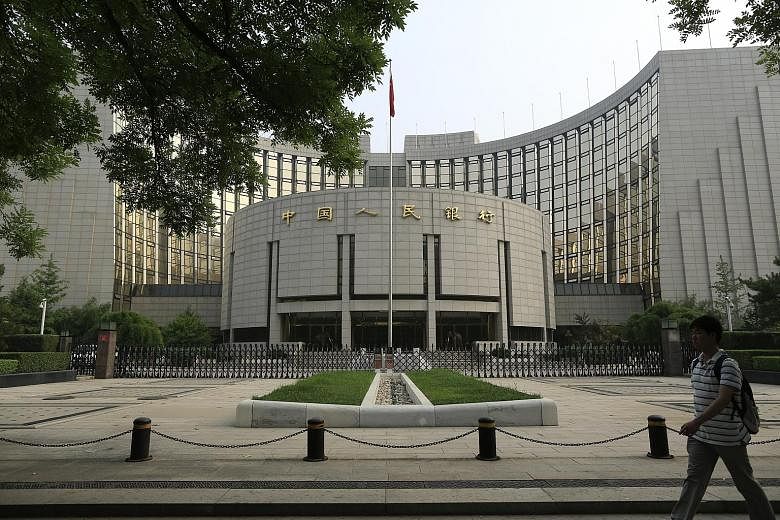 The People's Bank of China (above) has depreciated the yuan, which was at a four-week low yesterday. The move, which hit the stock market negatively, showed China is prioritising growth for now, said an analyst.