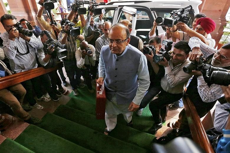 Mr Jaitley, India's Finance Minister, arriving at Parliament to present the Budget for the 2016/2017 fiscal year in New Delhi yesterday. He announced a big funding increase for the national rural employment guarantee scheme to $8 billion.