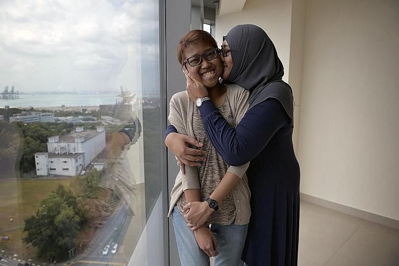 Ms Siti Rasyidah Lokman Hadan (far left), 23, is Singapore's first recipient of a paired kidney exchange transplant. Someone who came forward to donate a kidney to a stranger was found to be a match for Ms Siti. In exchange, her mother, Madam Noor Ra