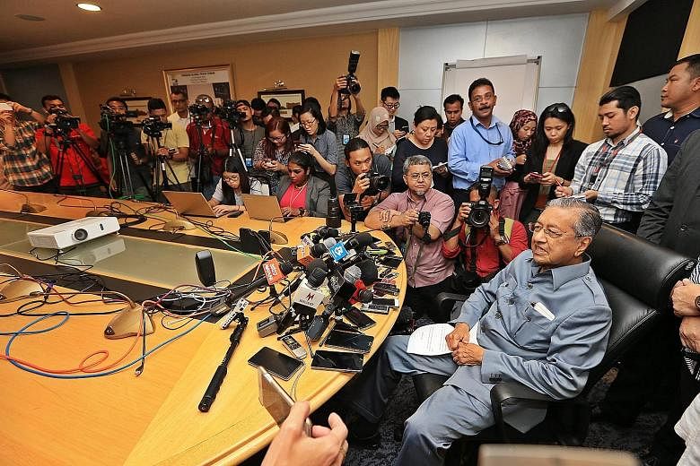 Dr Mahathir at a press conference yesterday. On top of giving the reasons for his resignation, he also finally abandoned his insistence that removing Mr Najib is all that is needed to reform Umno.