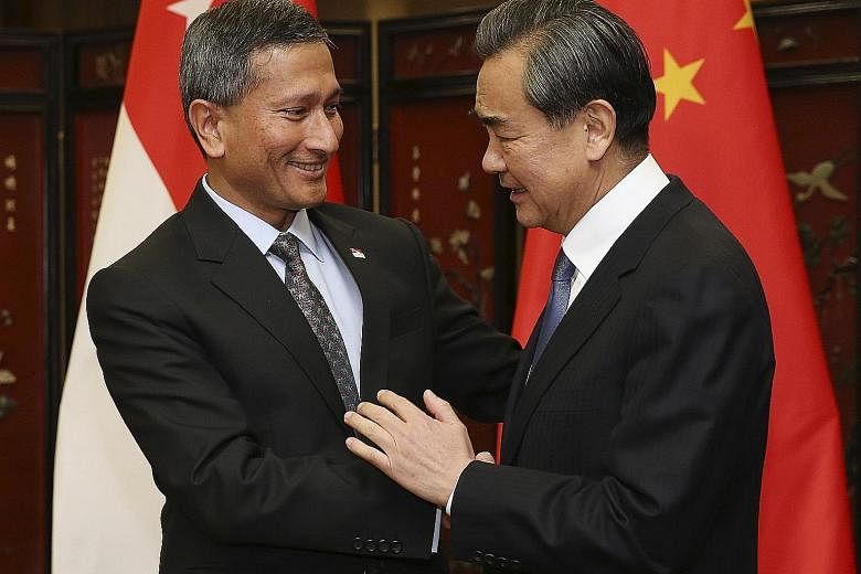 Foreign Minister Vivian Balakrishnan meeting his Chinese counterpart Wang Yi in Beijing yesterday. Dr Balakrishnan is on his first visit to China since becoming Foreign Minister on Oct 1 last year. He also met Vice-President Li Yuanchao yesterday.