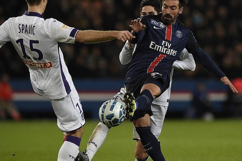 Ezequiel Lavezzi vying with Toulouse's Uros Spajic in their French League Cup match in January. The Argentinian spurned offers from Inter, Chelsea and United to move to Chinese side Hebei Fortune.
