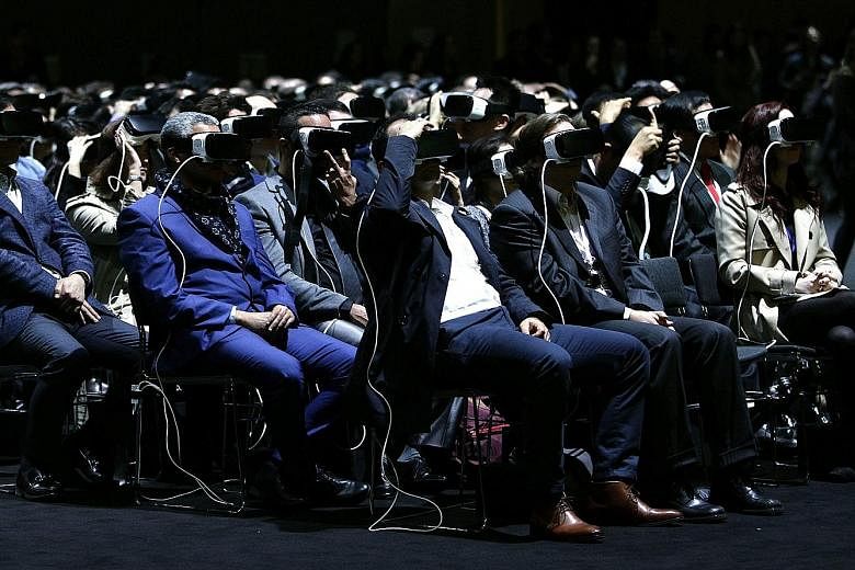 People checking out VR goggles during Samsung's presentation on a preview day of the Mobile World Congress in Barcelona, Spain, last week.