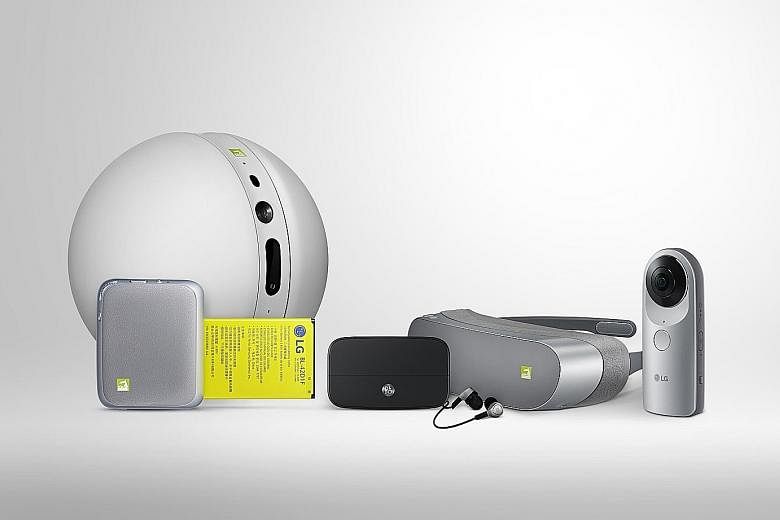 LG's latest smartphone, the G5 (below) has many "friends". They include (above, from left) the Rolling Bot, the Cam Plus camera accessory, the Bang & Olufsen co-created sound module Hi-Fi Plus, the 360 VR and the 360 Cam.