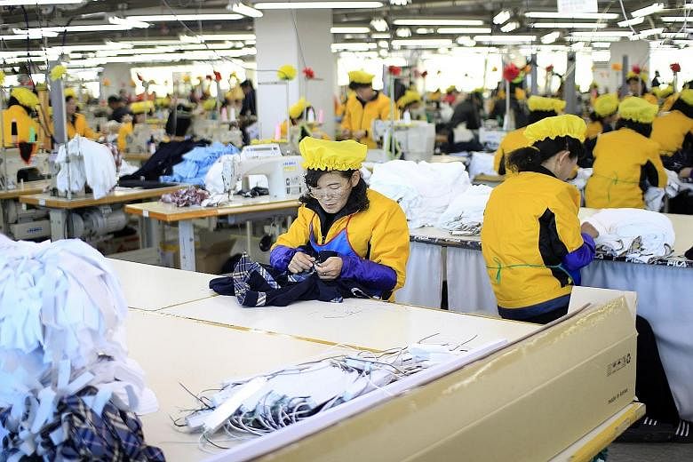 North Korean women working at a garment factory based in the inter-Korean Kaesong Industrial Complex last year.