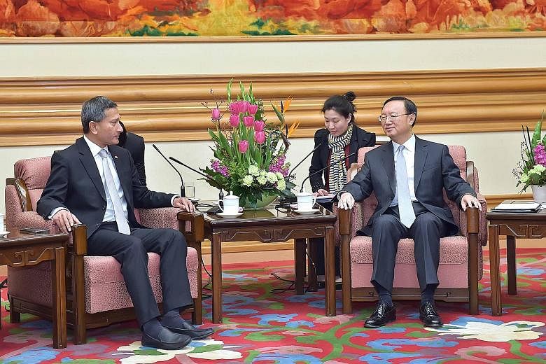 Foreign Minister Vivian Balakrishnan with Chinese State Councillor Yang Jiechi in Beijing yesterday. Singapore's proposal of an expanded Code for Unplanned Encounters at Sea was made as part of the Republic's role as country coordinator for China-Ase