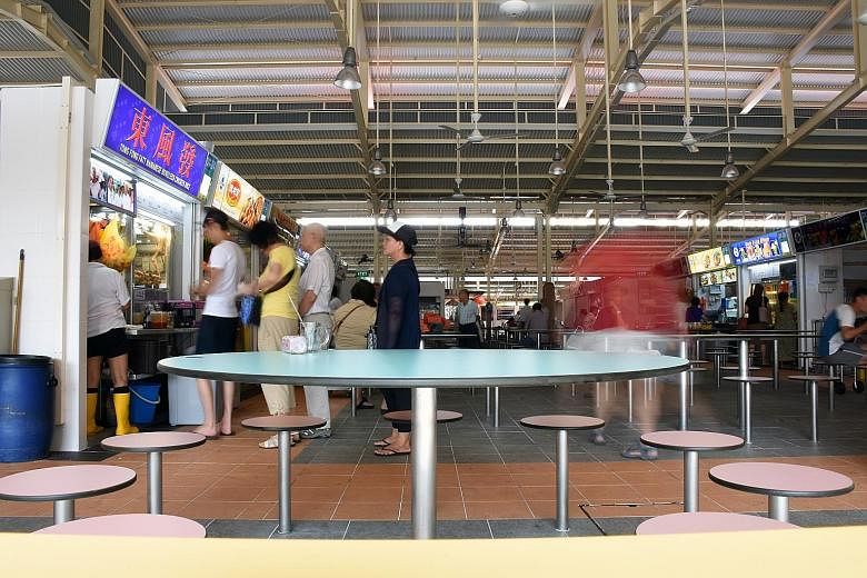 Ghim Moh Market and Food Centre re-opened on Tuesday after a year and a half of renovations, boasting floors scrubbed clean of years of grime, wider walkways and better ventilation.