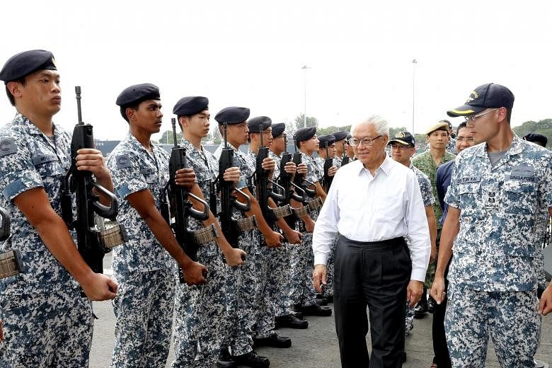 President Tony Tan inspecting the guard yesterday at Changi Naval Base. This is his first visit to the base since being elected in 2011. Dr Tan was the Defence Minister between 1995 and 2003.