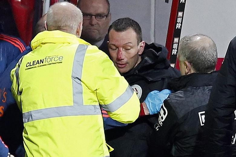 Fourth official Kevin Friend receiving medical attention on Tuesday after collapsing and hitting the dug-out, resulting in a bloodied nose. He was kept overnight in hospital as a precaution.