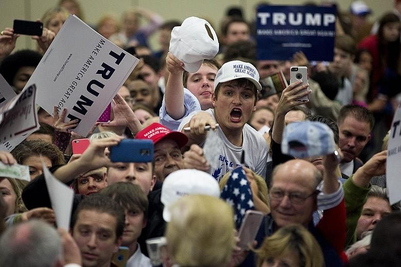 Supporters eagerly waiting for Mr Donald Trump's autograph at the Kentucky International Convention Centre in Louisville, Kentucky, on Tuesday. Interviews with Trump voters revealed a diversity of support that could sustain him as a front runner in t