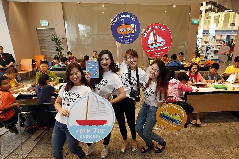 The team of (from left) Ms Natalie Huam, Ms Lynette Teo, Ms Fiona Tan and Ms Miranda Yeo, all aged 22, conducting a workshop at Pasir Ris Public Library. They aim to reach children from lower-income families with their news literacy campaign because 