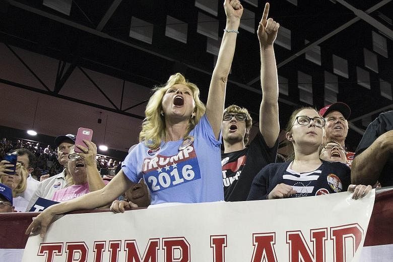 Ms Maree Miller cheering as Mr Trump spoke to supporters at a rally at Valdosta State University in Georgia on Monday. Analysts say the tycoon is picking up many working-class voters, the same demographic that Democratic candidate Hillary Clinton is 
