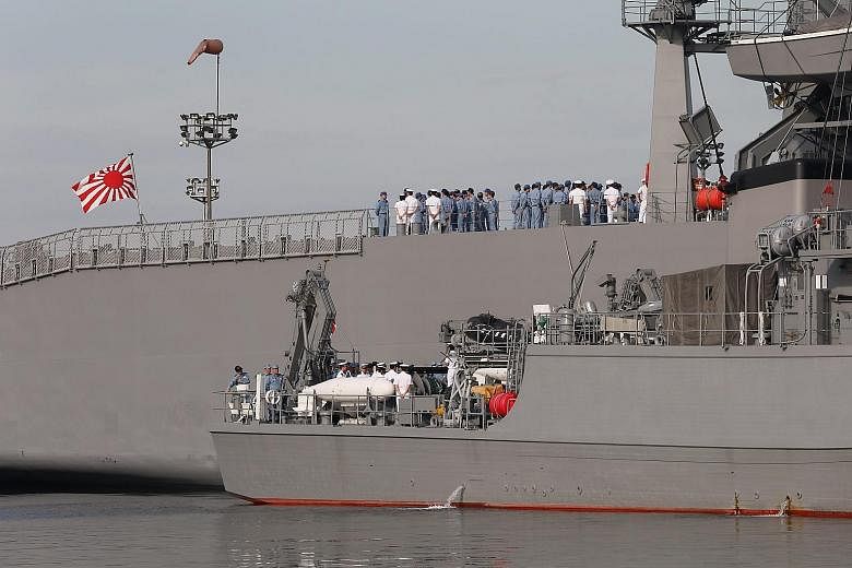 Two Japanese minesweeper- class vessels at a port in Manila yesterday, after arriving for a three-day goodwill visit on Wednesday. US Admiral Harry Harris said the annual Malabar exercise involving the navies of India, the US and Japan would be held 