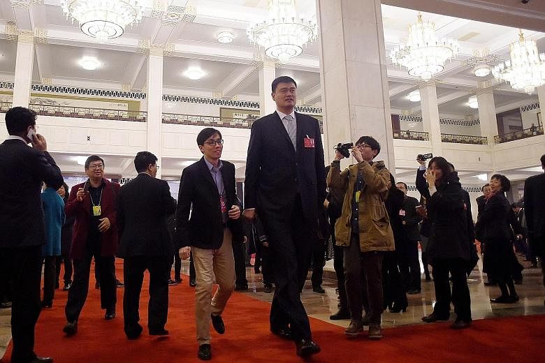 Former National Basketball Association star Yao Ming (centre) was spotted at the opening session of the Chinese People's Political Consultative Conference at the Great Hall of the People yesterday.