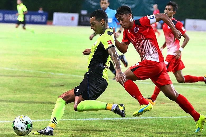 Tampines Rovers star Jermaine Pennant in action with Home United captain Juma'at Jantan during their S-League encounter last night. The match ended 1-1.