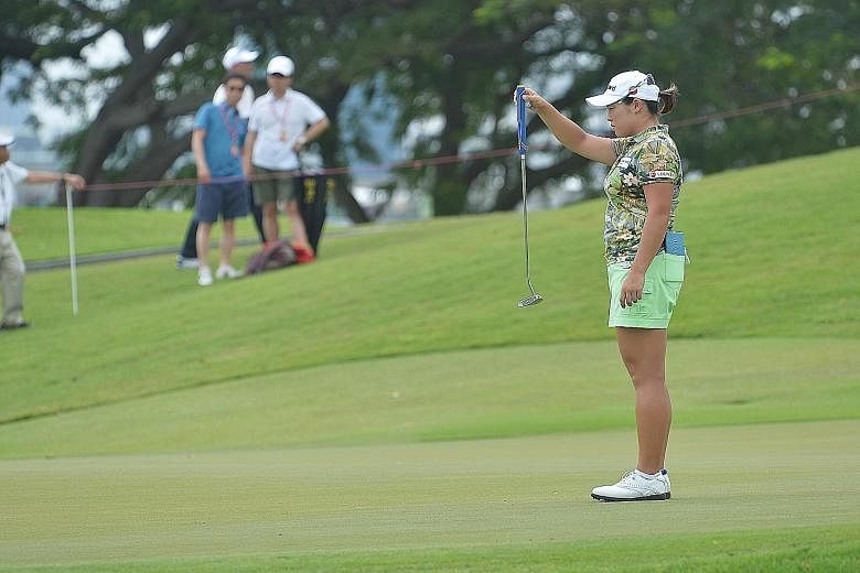 South Korean Jang Ha Na weighs up a putt during the second round of the HSBC Women's Champions yesterday. She currently holds the lead at the Sentosa Golf Club with her compatriot Lee Mi Rim.