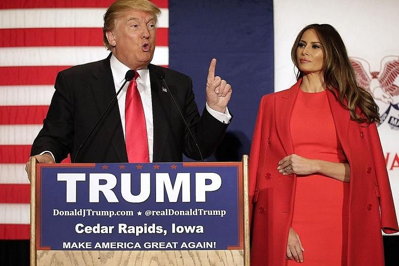 Above: Slovenian model Melania Knauss appearing on the cover of GQ magazine in January 2000. She and Mr Trump were dating at the time. Left: Mr Trump and wife Melania at a campaign event at the US Cellular Convention Centre on Feb 1 in Cedar Rapids, 