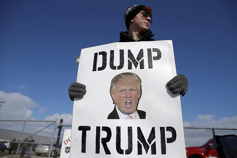 A protester demonstrating at a Republican rally last week. Senior party figures hope to deny Mr Trump enough delegates to clinch the presidential nomination but their attempts to find an alternative candidate are going nowhere.