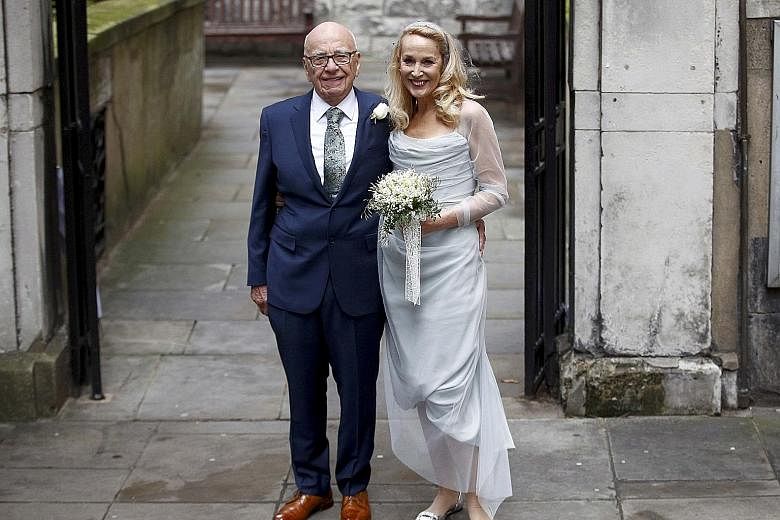 Rupert Murdoch and Jerry Hall outside St Bride's Church following a service to celebrate their wedding, which took place last Friday.