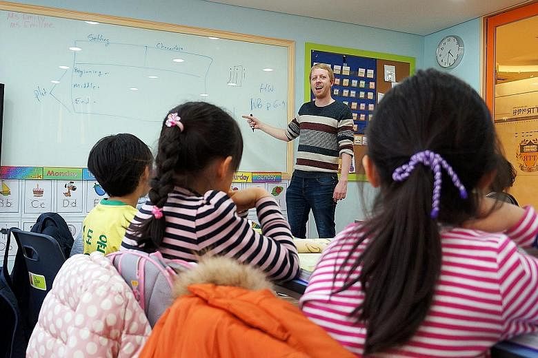 English language teacher Keegan Price conducting a class at a private English language institute. Seoul bans the teaching of English in the first two years of primary school, both public as well as private.