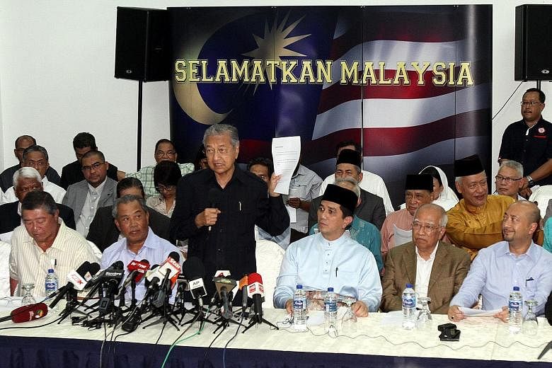Tan Sri Muhyiddin Yassin (front row, second from left) and Datuk Seri Mukhriz Mahathir (front row, far right) at the "citizens' declaration" press conference organised by former PM Mahathir Mohamad (standing) last Friday in Kuala Lumpur.