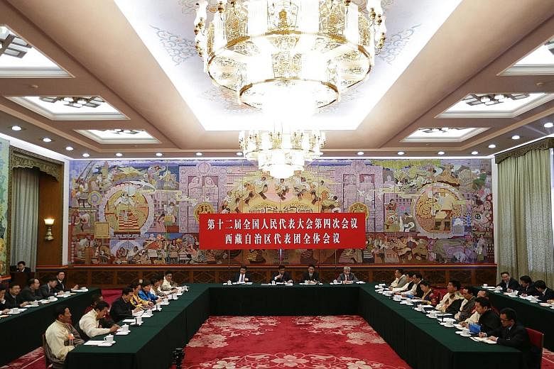 A general view of Tibet Hall during the Tibet delegation meeting on the sidelines of the fourth session of the 12th National People's Congress (NPC) at the Great Hall of the People in Beijing yesterday. The NPC has over 3,000 delegates and is the wor