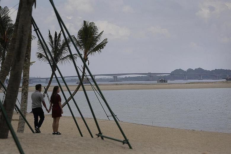The shore of Forest City, with the Tuas Second Link to Singapore in view. Amid ongoing talks, Country Garden insists it is reclaiming within Malaysian boundaries.