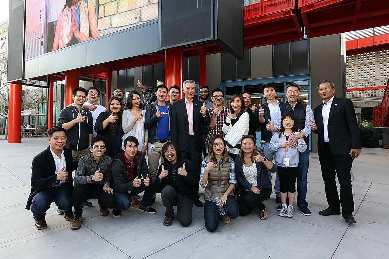 PM Lee Hsien Loong and Foreign Minister Vivian Balakrishnan (far right) with Singaporeans working at Facebook in California last month. PM Lee encouraged Singaporeans working in the US to maintain their links and return one day.