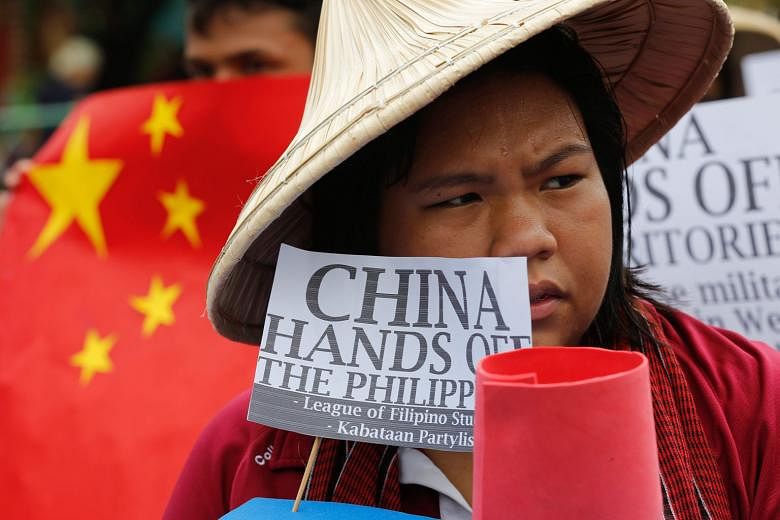 A Filipino student in Manila protesting against China's actions in the South China Sea. The writer says there is no provision in Unclos on a State's "right" not to participate if a case is instituted against it. PHOTO: EUROPEAN PRESSPHOTO AGENCY