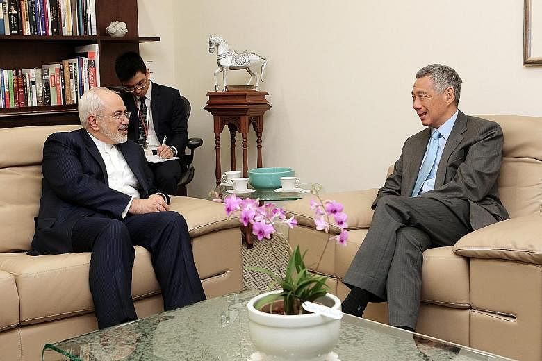 Visiting Iranian Foreign Minister Javad Zarif calling on Prime Minister Lee Hsien Loong at the Istana yesterday. Dr Zarif, who is on a three-day visit to Singapore, also met his counterpart, Foreign Minister Vivian Balakrishnan, earlier in the day, a