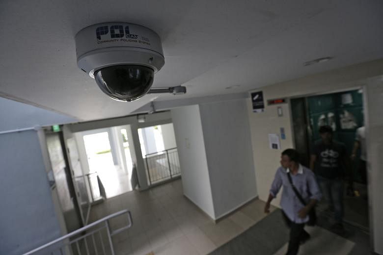 A security camera at a lift lobby in a Pasir Ris housing estate. Footage from police cameras has led to the arrests of unlicensed moneylenders in 360 cases of harassment since 2012.