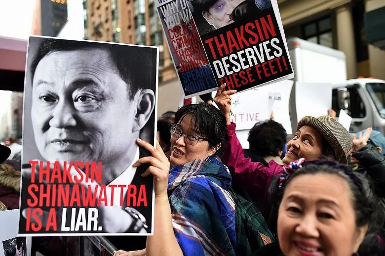 Demonstrators protesting against Thaksin on Wednesday outside a New York private club, where the deposed Thai premier was speaking at an event.