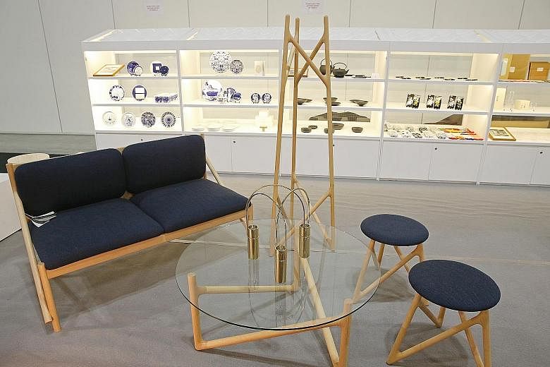 Supermama collaborates with Japanese furniture-maker Legnatec to create wooden furniture (left).
