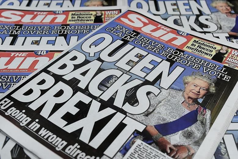 Copies of Britain's The Sun newspapers with a front-page story saying Queen Elizabeth II backed Brexit. A spokesman for the royal family has stated that the Queen is "politically neutral".