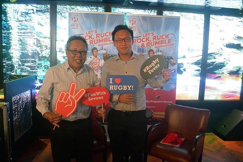 Rugby SG chairman Low Teo Ping (left) posing with Clarke Quay's Adrian Lai, ahead of the Singapore Sevens on April 16-17.