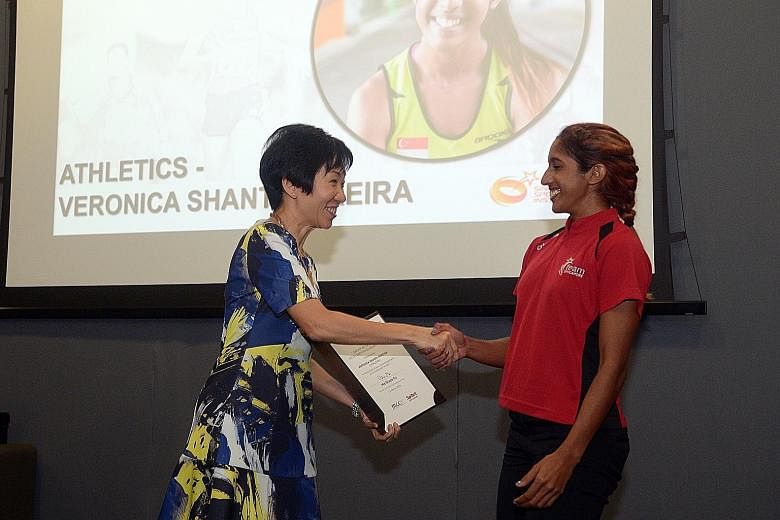 Minister for Culture, Community and Youth Grace Fu handing Shanti Pereira her award. The SEA Games 200m champion is thankful for the backing she will get as she bids to race at the 2018 Asiad and 2020 Olympics.