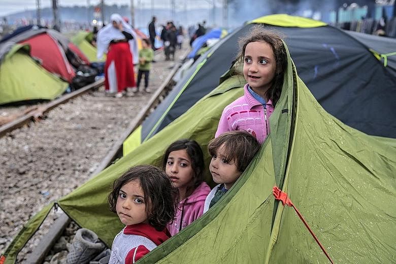 Refugees at the border between Greece and Macedonia. After Slovenia, Croatia, Serbia and Macedonia sealed their borders to the migration flow, tens of thousands of people have been left stranded in Greece.